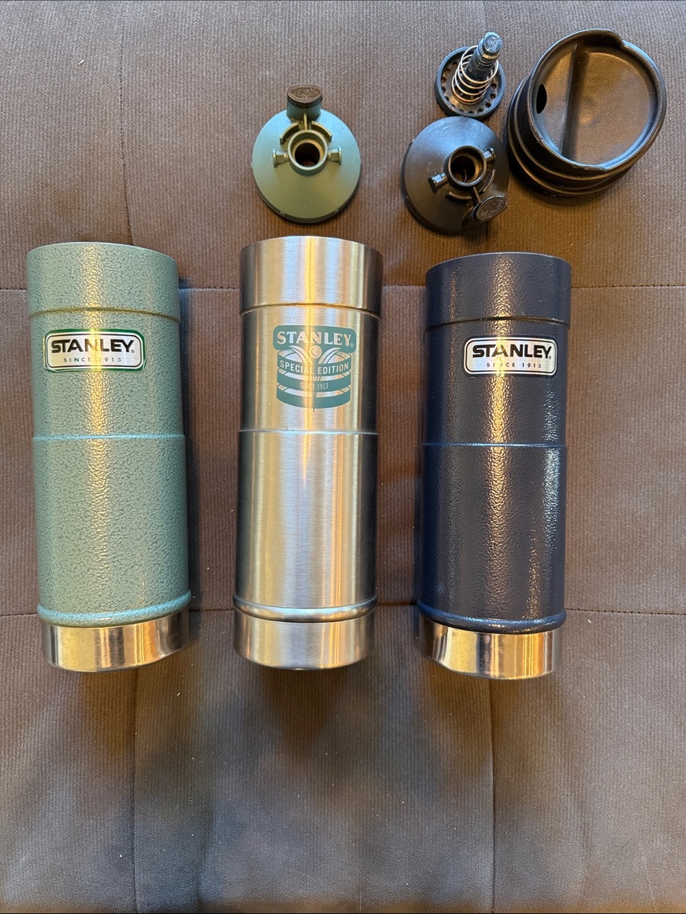 Lot of 3 Stanley Travel Bottles in Green, Stainless, and Navy